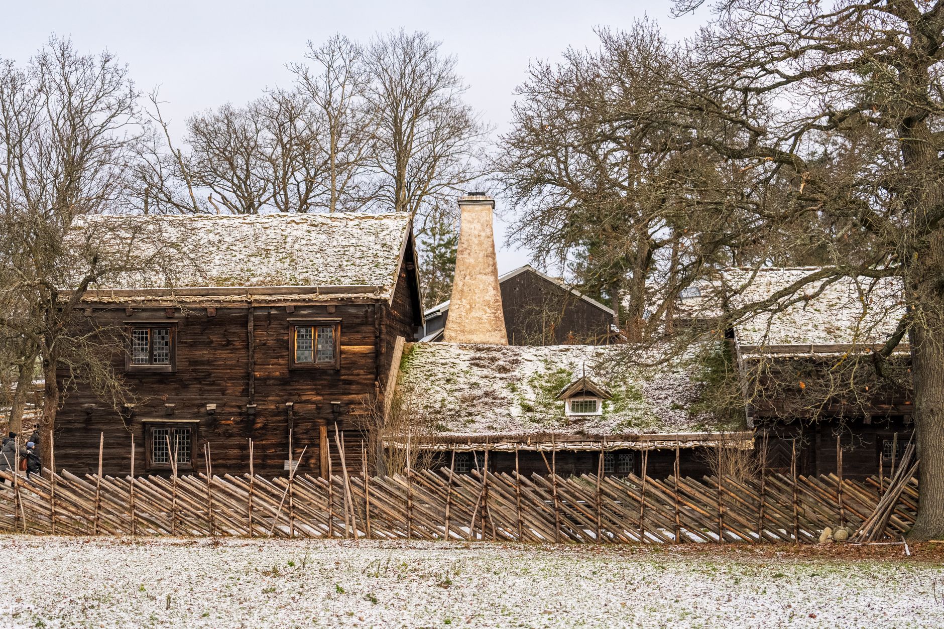 Beautiful snowy Swedish farmhouse in winter with rustic charm.